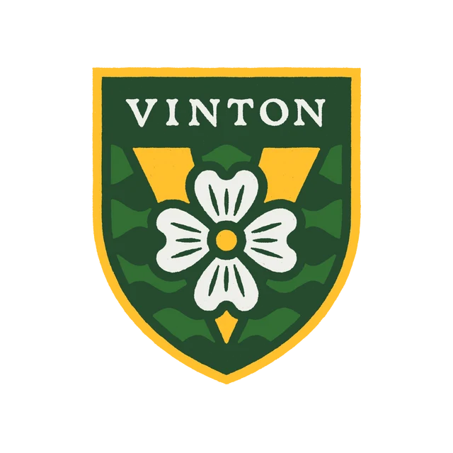 Shield-shaped crest with a gold border, green field, Dogwood flower and the word "VINTON" in white at the top.